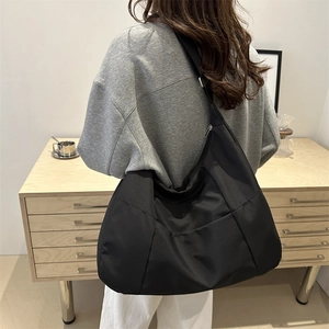 Large black nylon tote bag for women with wide strap for work and daily commute