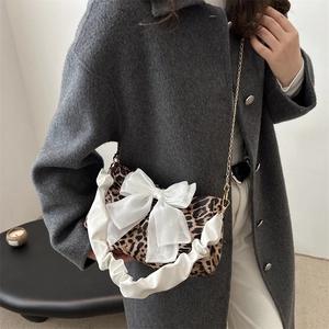 Fashionable leopard print baguette bag with white bow and pleated handle for women