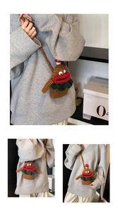 Detail of a handmade crochet crossbody bag with funny red lips and mushroom ornament