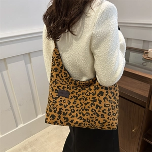 Fashionable leopard print corduroy tote bag with spacious interior and shoulder strap