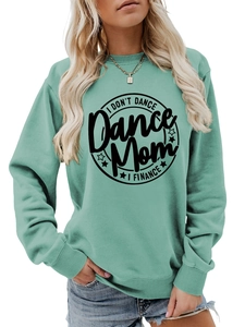 Detail of mint green sweatshirt featuring I DON'T DANCE text and ribbed crew neck