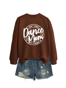Detail of dark brown sweatshirt with I DON'T DANCE print and ripped blue denim shorts