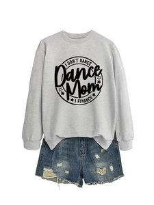 Flat lay of a grey crewneck sweatshirt with 'Dance Mom' print and ripped denim shorts