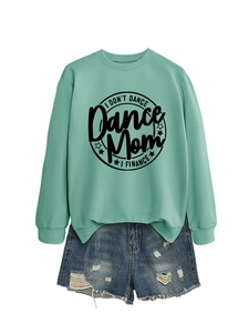 Detail of mint green sweatshirt with Dance Mom print paired with distressed denim shorts