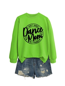 Flat lay of neon green Dance Mom sweatshirt and distressed blue denim shorts set