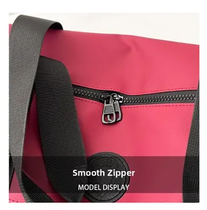 Macro shot of smooth black zippers and high-density woven handle on pink travel bag