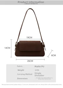 Detail view of brown matte PU baguette bag with dimensions 26x14x6cm and strap info