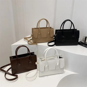 Minimalist PU leather tote bag in four colors with top handles and adjustable shoulder strap
