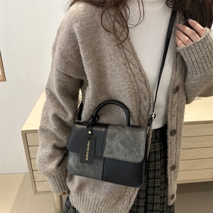Modern patchwork crossbody square bag with grey contrast panels and round top handle