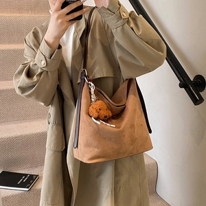 Brown faux suede hobo tote bag with shoulder strap and a cute teddy dog plush pendant