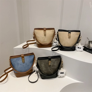 Retro color-block bucket bags with metal locks and plush pendants in four various colors