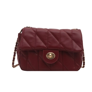 Elegant wine red quilted leather crossbody bag with gold chain strap and metal lock