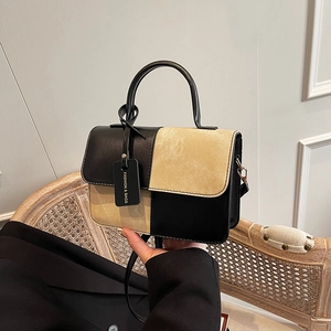 Retro patchwork crossbody bag in black leather and beige suede with top handle