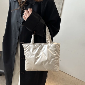 Chic quilted metallic tote bag for women with padded silver nylon handles in winter style
