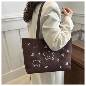 Detailed embroidery of cartoon bear on large brown suede tote bag for women