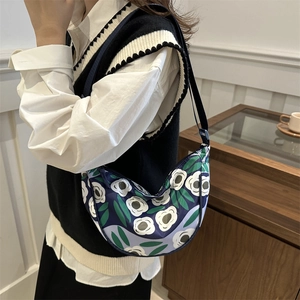 Floral print navy blue crescent shoulder bag with adjustable strap for daily commute
