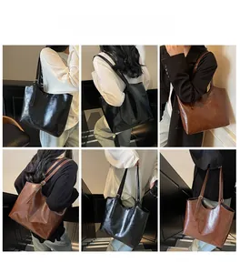 Lifestyle model views of black and brown large oil wax leather tote bags with glossy finish