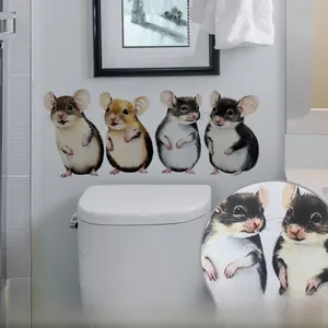 Detailed view of hand-painted watercolor mouse wall decals on a clean modern bathroom wall