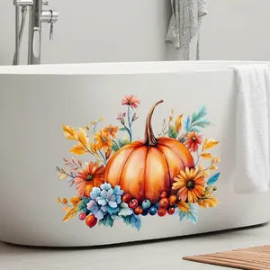 Watercolor pumpkin and floral window sticker applied on a white bathtub side surface