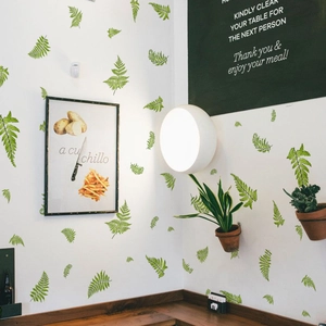 Stickers muraux feuilles de fougère peintes à la main dans un café moderne et chic