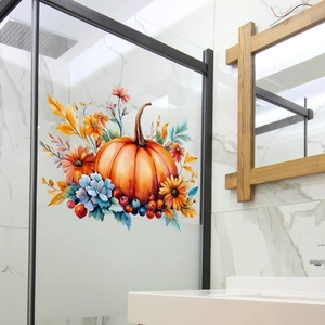 Detail of watercolor pumpkin and sunflower window decal on a frosted glass door