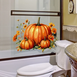 Detail of watercolor autumn pumpkin window stickers on transparent glass shower door