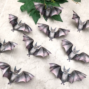 Detailed 3D purple Halloween bat wall stickers set with red eyes on marble background