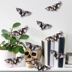 3D Halloween bat stickers decorating a skull and bookshelf for spooky home decor