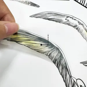 Detail of self-adhesive wall sticker showing the easy peel-off back for creative decoration