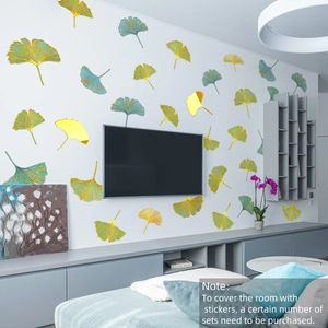Detail of golden and teal ginkgo leaf wall stickers on a modern living room TV background