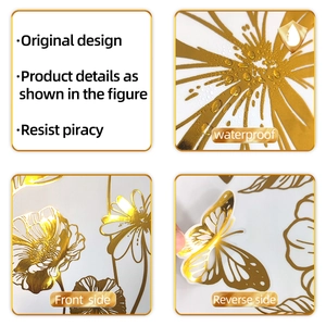 Detailed view of waterproof golden floral and butterfly wall stickers with metallic texture