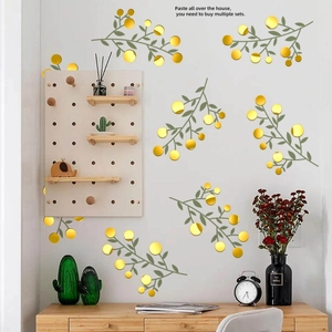 Detail of 3D gold floral mirror wall stickers applied on a modern living room wall