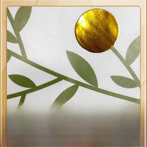 Macro detail of hot stamping process with green leaves and gold foil on frosted wall sticker