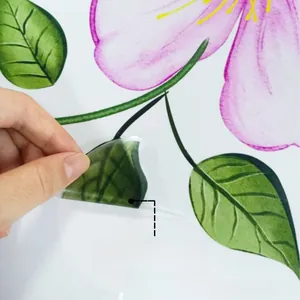 Close-up of adhesive flower wall sticker showing the easy peel-off and stick backing
