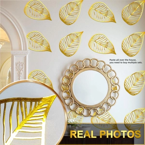 Detail of high-gloss gold hollow leaf vein wall stickers with metallic texture for decor