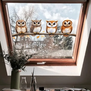 Creative owl and tree branch static window clings applied to a sunlit skylight window