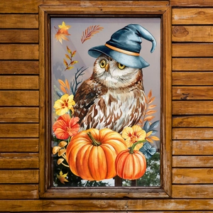 Detail of artistic watercolor owl and pumpkin window sticker with stained glass effect