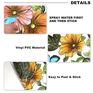 Detail of pink floral window decals with gold outlines and water-spray application method