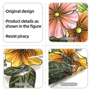 Detail showing the double-sided floral window sticker with 3D embossed texture and gold outlines