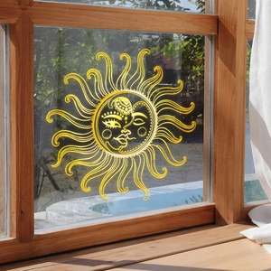 Golden sun and moon line art wall decal on glass window with elegant metallic finish