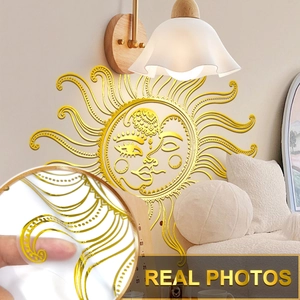Detailed close-up showing the peelable gold sun wall sticker with a metallic finish
