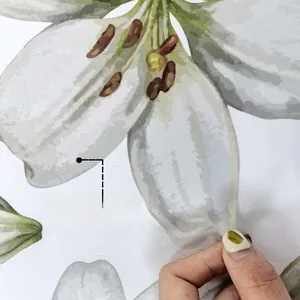 Macro detail of self-adhesive lily flower sticker showing double-sided design and texture