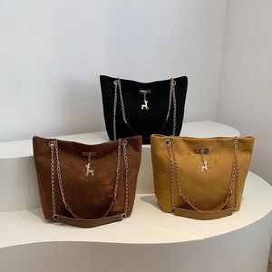 Vintage chain shoulder tote bags in black, dark brown and yellow with deer pendant detail