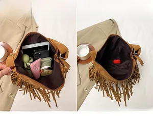Spacious main compartment of brown suede fringe bag showing capacity for tablets and phones