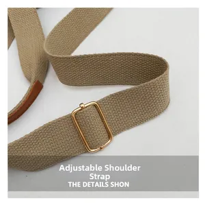 Close-up of adjustable woven shoulder strap with gold buckle and leather trim details