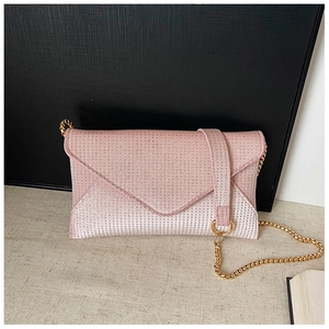 Detail view of pink rhinestone envelope clutch with gradient sparkle and gold chain