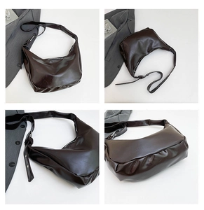 Detail view of deep brown oily faux leather hobo bag showing texture and adjustable strap