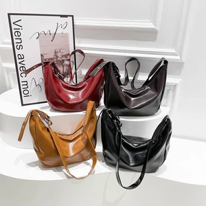 Collection of minimalist leather crescent tote bags in four classic autumn colors