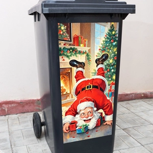 Detail showing creative Santa Claus and Christmas tree decals on a black outdoor wheelie bin