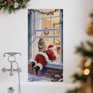 Detail of Christmas wall sticker showing Santa Claus peeking through a snowy window scene